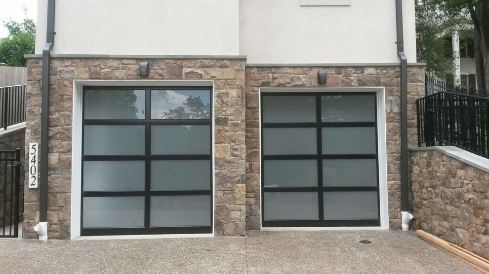 This is an example of a mid-sized contemporary attached two-car garage in DC Metro.