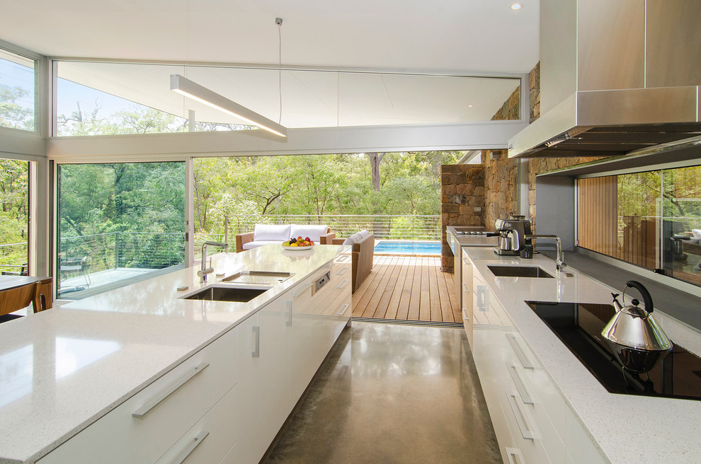 Inspiration for a contemporary galley eat-in kitchen in Perth with white cabinets and with island.