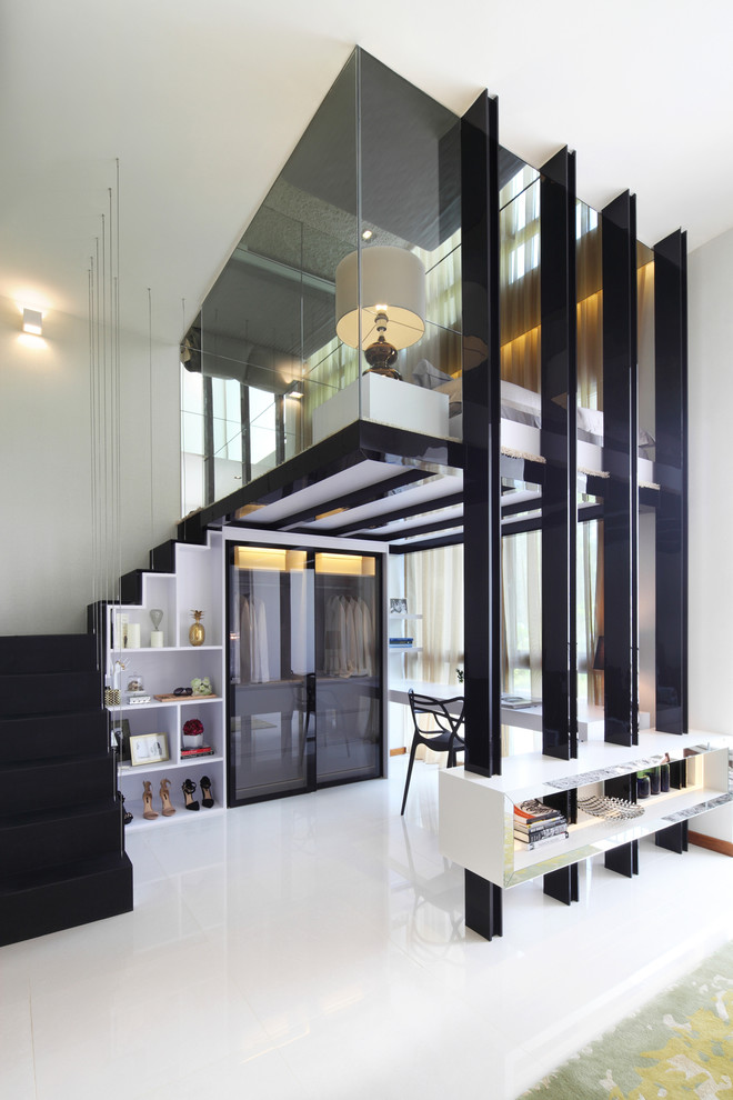 Trendy gender-neutral dressing room photo in Singapore with glass-front cabinets