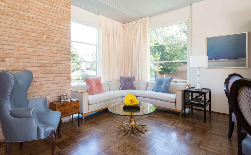 Large midcentury formal enclosed living room in Houston with white walls, dark hardwood floors, brown floor, no fireplace and no tv.