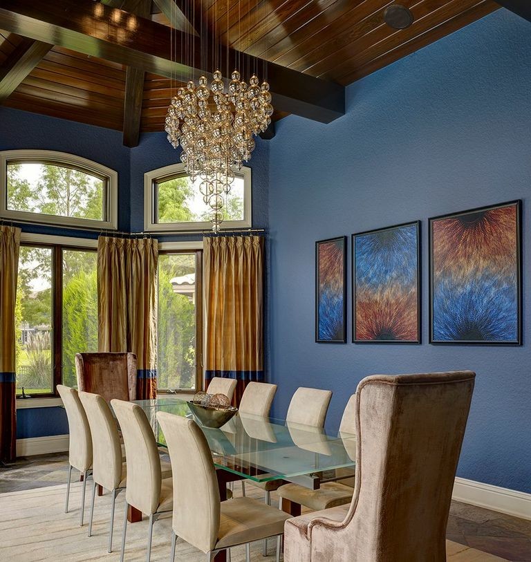 Design ideas for a large transitional separate dining room in Orlando with blue walls and slate floors.