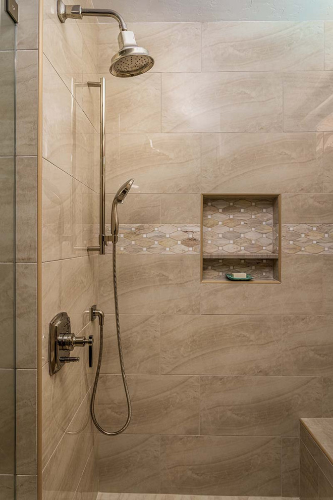 This is an example of a mid-sized country master bathroom in San Diego with flat-panel cabinets, medium wood cabinets, a drop-in tub, a corner shower, a two-piece toilet, beige tile, porcelain tile, beige walls, porcelain floors, an undermount sink, quartzite benchtops, beige floor, a hinged shower door, beige benchtops, a shower seat, a single vanity and a built-in vanity.