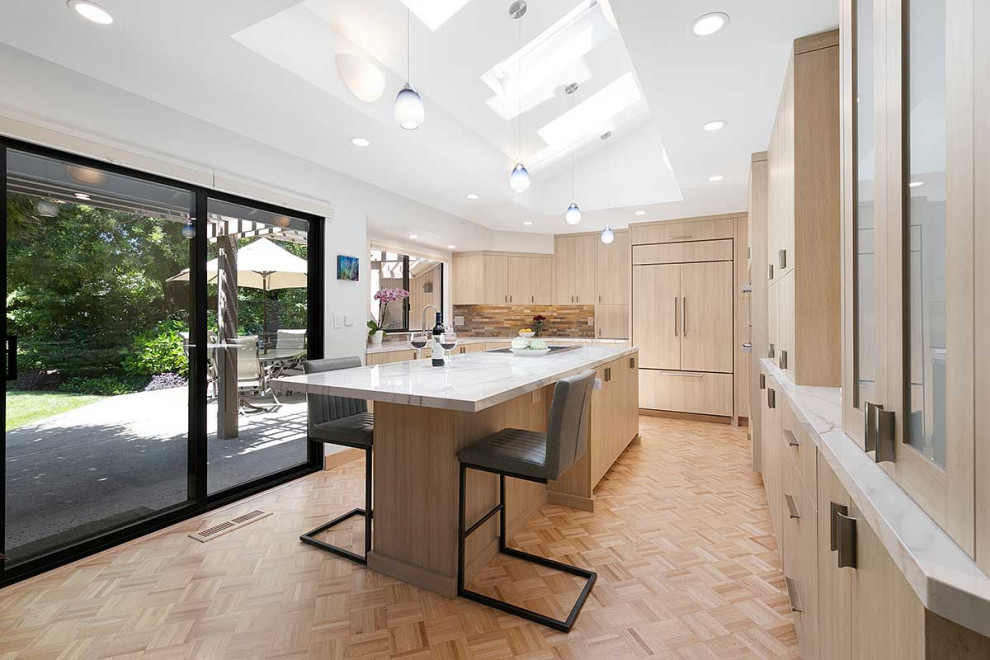 Inspiration for a large contemporary l-shaped kitchen/diner in San Francisco with a submerged sink, flat-panel cabinets, light wood cabinets, multi-coloured splashback, stone tiled splashback, integrated appliances, plywood flooring, an island, beige floors, white worktops and a vaulted ceiling.