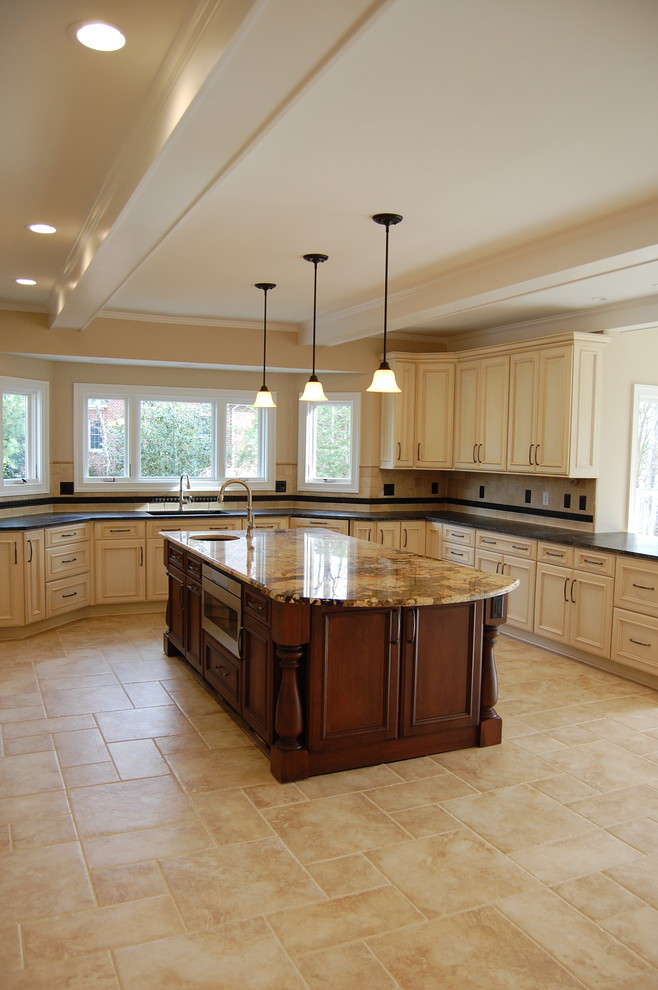 Inspiration for a large traditional u-shaped eat-in kitchen in DC Metro with an undermount sink, recessed-panel cabinets, white cabinets, granite benchtops, beige splashback, ceramic splashback, stainless steel appliances and with island.