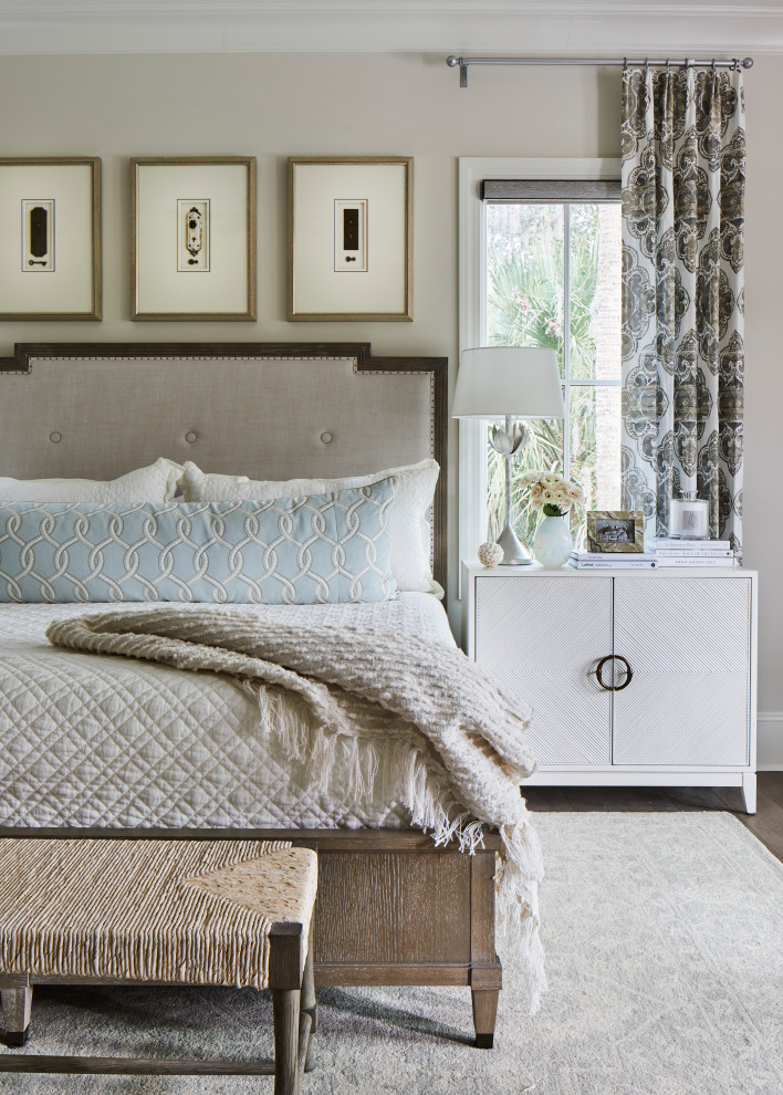 Large bohemian master bedroom in Other with beige walls, dark hardwood flooring and brown floors.