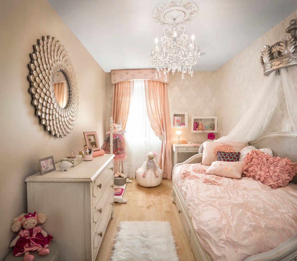 Mid-sized traditional kids' bedroom in New York with beige walls and light hardwood floors for kids 4-10 years old and girls.
