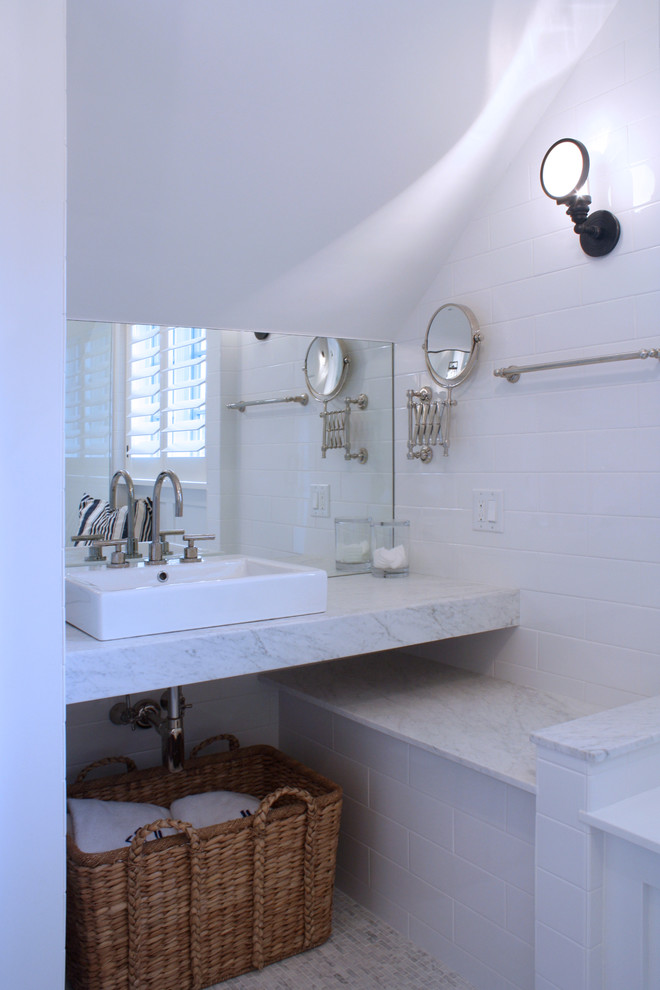 Photo of a small contemporary bathroom in Chicago with white tile, subway tile, white walls, a trough sink and marble benchtops.
