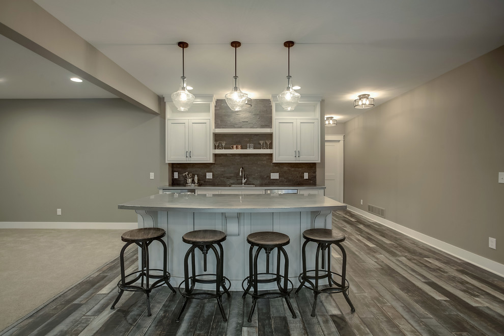 Basement - transitional basement idea in Grand Rapids with beige walls