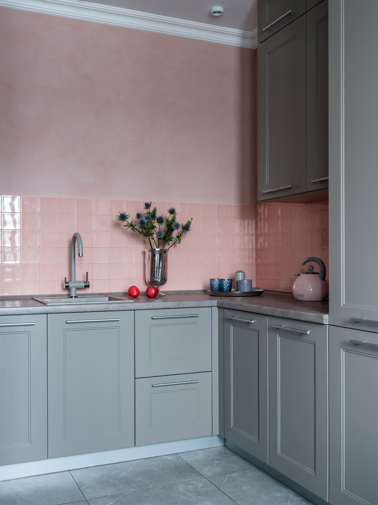 Inspiration for a small transitional u-shaped open plan kitchen in Moscow with a single-bowl sink, recessed-panel cabinets, grey cabinets, pink splashback, ceramic splashback, no island, grey benchtop and grey floor.