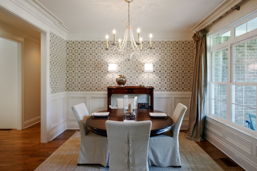 This is an example of a traditional dining room in Other with beige walls, dark hardwood floors and no fireplace.