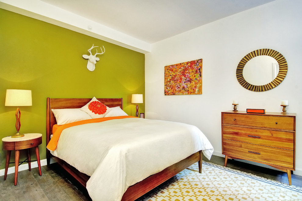 Design ideas for a midcentury bedroom in New York with green walls.