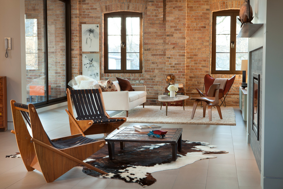 Design ideas for an industrial living room in Chicago with a standard fireplace.