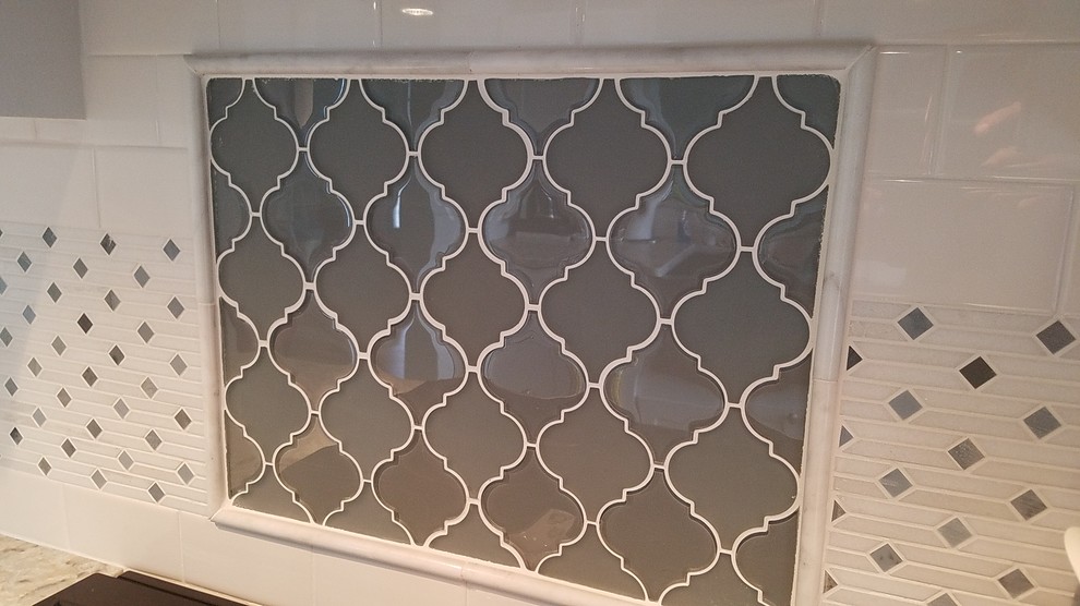 Kitchen - small transitional kitchen idea in Detroit with white backsplash and subway tile backsplash