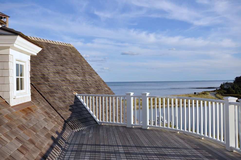This is an example of a large beach style rooftop deck in Boston with no cover and with dock.