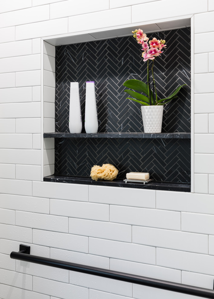 Inspiration for a small traditional bathroom in San Francisco with a built-in shower, a one-piece toilet, black and white tiles, ceramic tiles, grey walls, porcelain flooring, a pedestal sink, black floors, an open shower, a wall niche, a single sink and wainscoting.