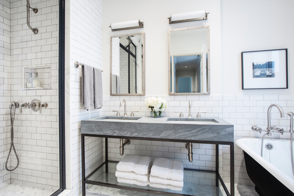 This is an example of an industrial bathroom in New York with an alcove shower, white tile, subway tile, white walls, an undermount sink and grey benchtops.