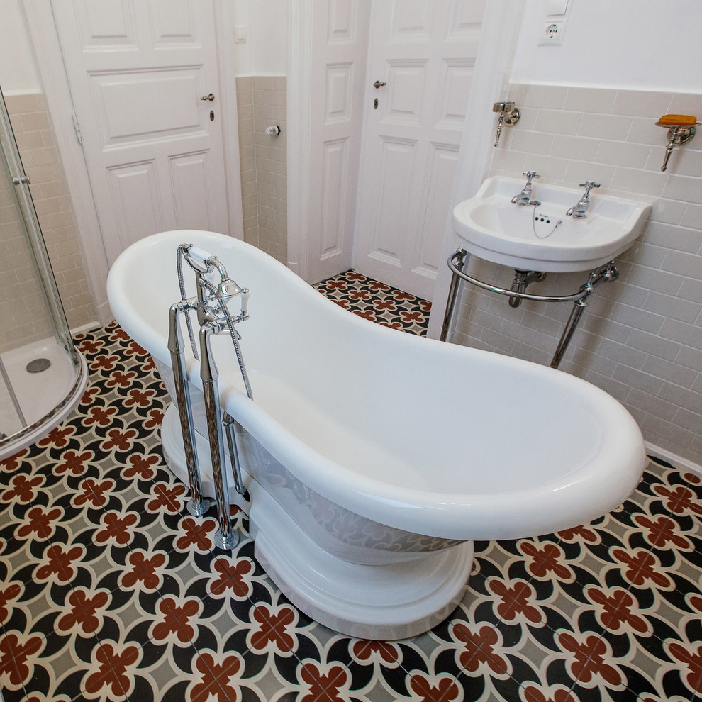 Photo of a mid-sized traditional kids bathroom in Other with a freestanding tub, a console sink, a corner shower, beige tile, white walls and mosaic tile floors.