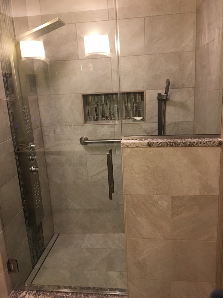 Design ideas for a mid-sized transitional master bathroom in Other with an alcove shower, beige tile, ceramic tile, beige walls, ceramic floors, blue floor, a hinged shower door and a drop-in sink.