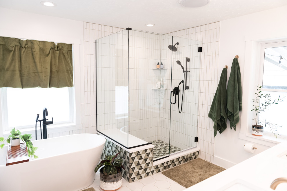 Photo of a large midcentury master bathroom in Salt Lake City with flat-panel cabinets, medium wood cabinets, a freestanding tub, a corner shower, white tile, ceramic tile, an undermount sink, engineered quartz benchtops, a hinged shower door, white benchtops, a double vanity, a built-in vanity, white walls, porcelain floors, white floor and a shower seat.