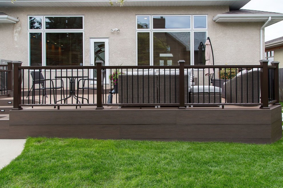 Mid-sized transitional backyard deck photo with no cover