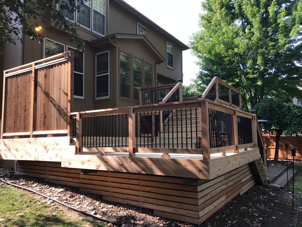 Photo of a large arts and crafts backyard deck in Kansas City.