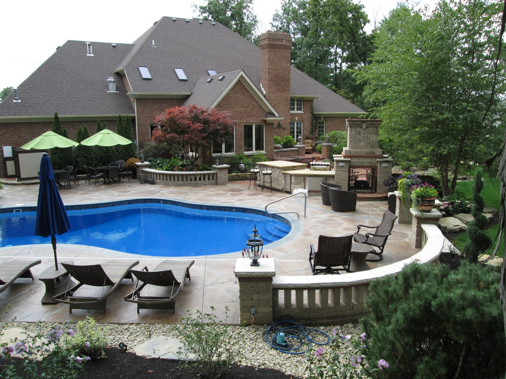 Pool - mid-sized transitional backyard stone and custom-shaped lap pool idea