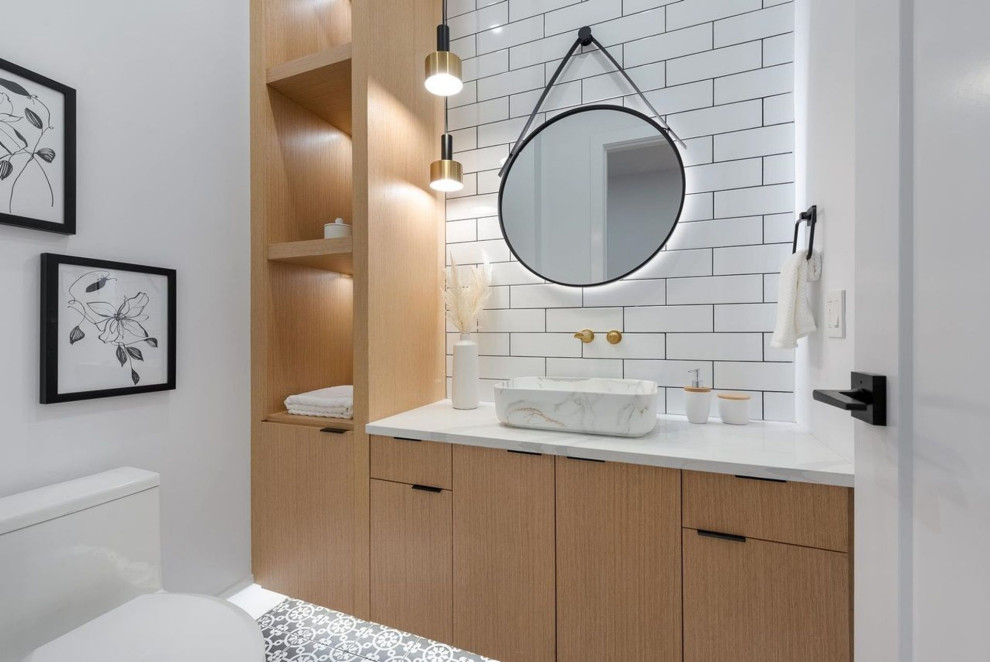 Inspiration for a small contemporary 3/4 bathroom in Vancouver with flat-panel cabinets, beige cabinets, a one-piece toilet, white tile, ceramic tile, white walls, porcelain floors, a vessel sink, terrazzo benchtops, grey floor, white benchtops, an enclosed toilet, a single vanity and a built-in vanity.