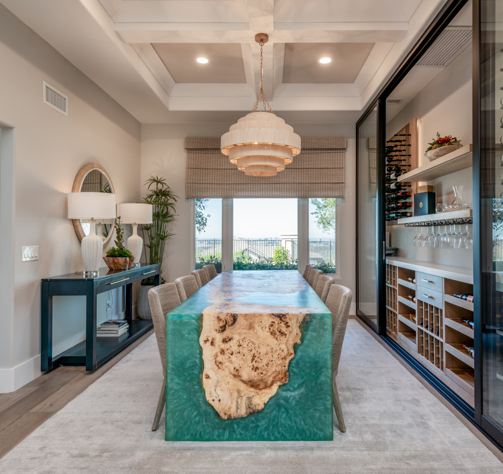 Inspiration for a medium sized beach style enclosed dining room in Orange County with grey walls, light hardwood flooring, beige floors and a coffered ceiling.