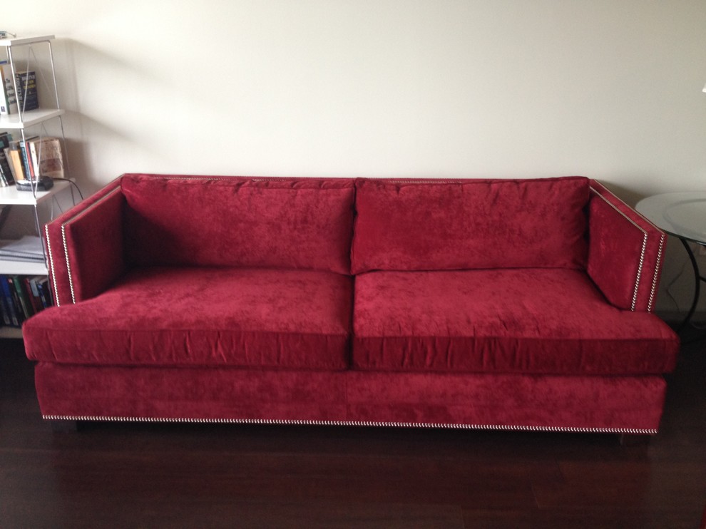 Decorating around red sofa in modern apartment.