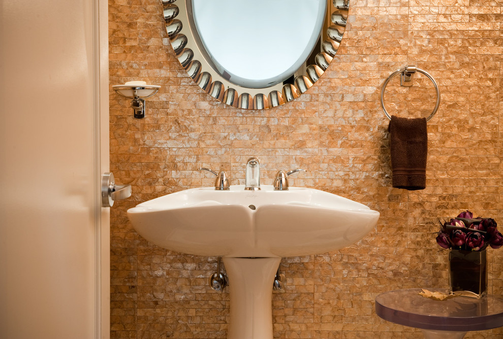 This is an example of a small contemporary bathroom in Chicago with a pedestal sink and multi-coloured tile.