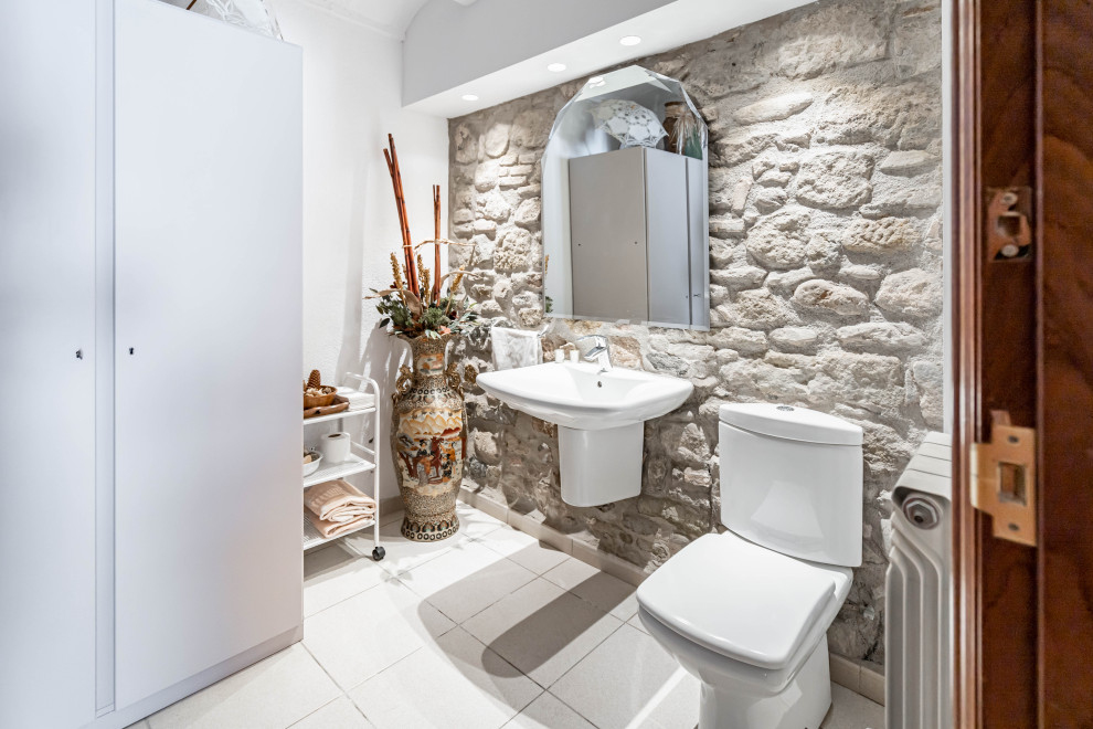 Medium sized rustic cloakroom in Other with open cabinets, distressed cabinets, stone tiles, a wall-mounted sink, white worktops, a built in vanity unit and a vaulted ceiling.