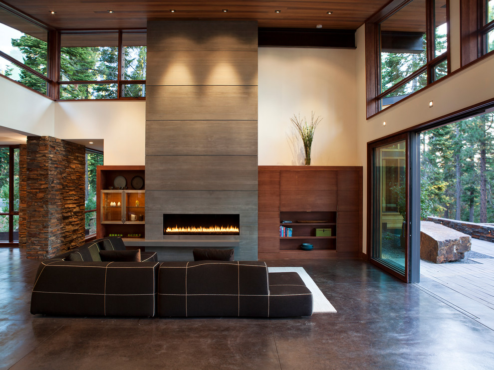 Expansive modern formal open concept living room in San Francisco with white walls, concrete floors, a ribbon fireplace, a concrete fireplace surround and a concealed tv.