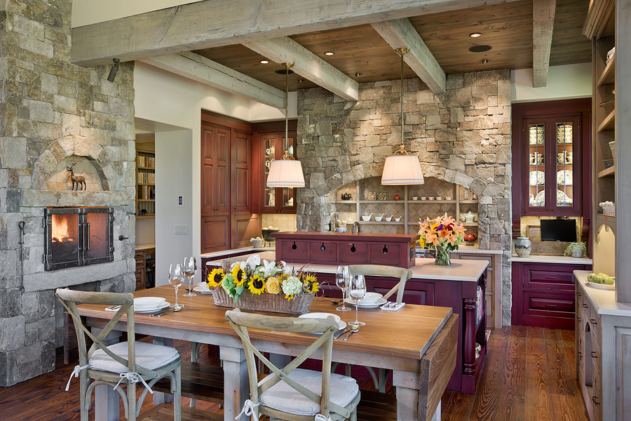 Mountain style medium tone wood floor eat-in kitchen photo with red cabinets, paneled appliances, an island and beaded inset cabinets