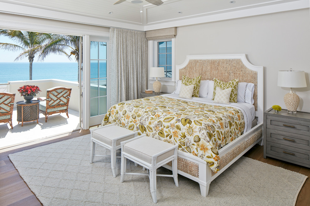 Inspiration for a mid-sized beach style master bedroom in Denver with white walls, dark hardwood floors, brown floor and no fireplace.