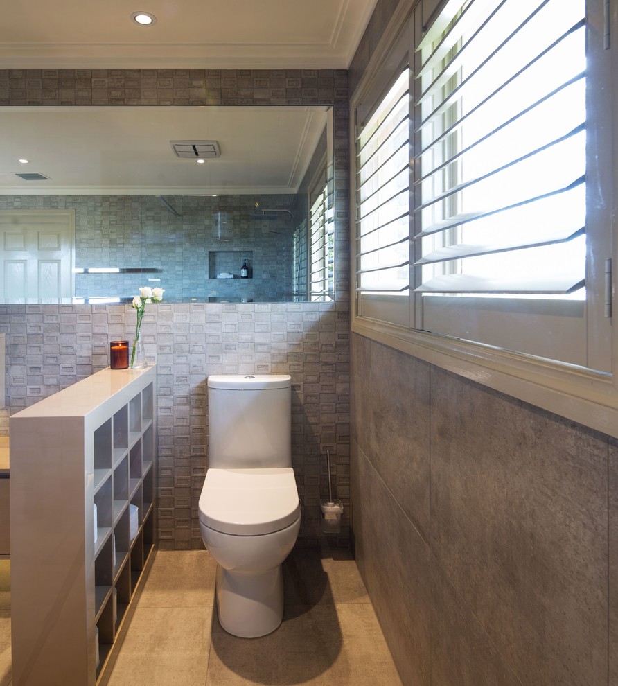 Design ideas for a mid-sized contemporary master bathroom in Melbourne with raised-panel cabinets, beige cabinets, a curbless shower, a one-piece toilet, beige tile, porcelain tile, beige walls, porcelain floors, a drop-in sink and engineered quartz benchtops.