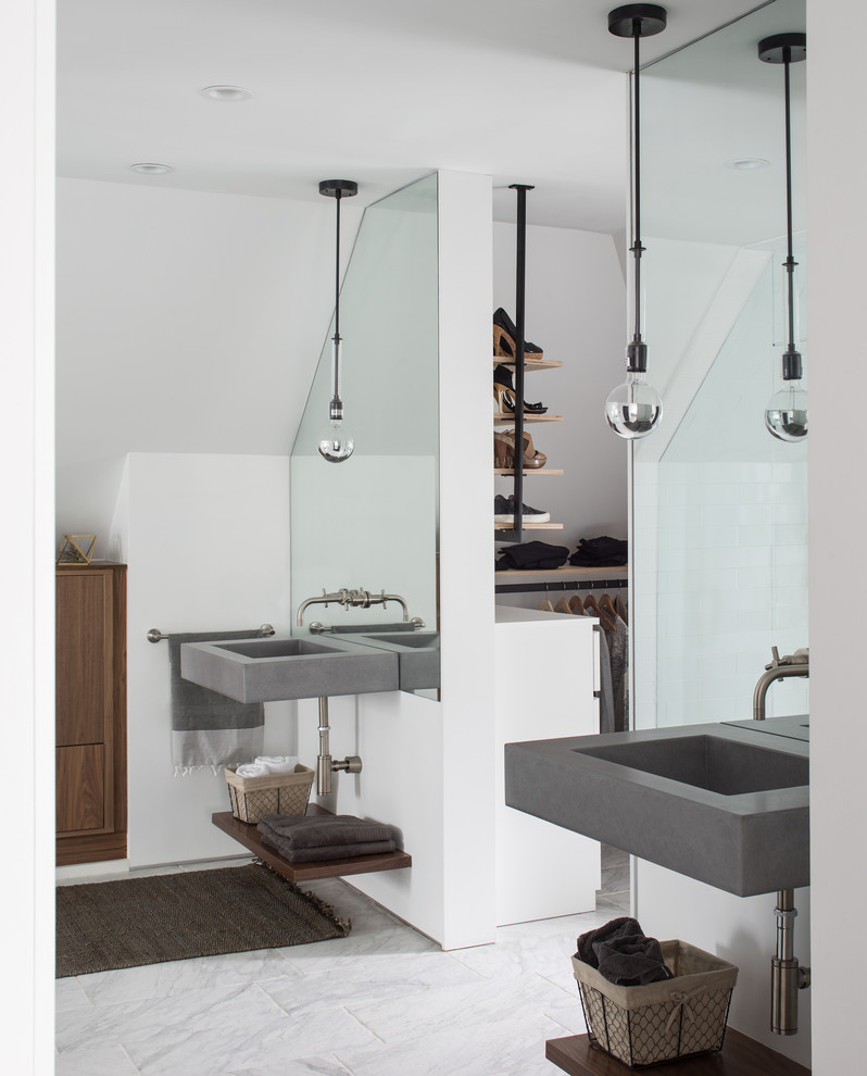 Photo of a mid-sized contemporary master wet room bathroom in Denver with open cabinets, medium wood cabinets, a freestanding tub, white tile, marble, white walls, porcelain floors, a wall-mount sink, concrete benchtops, white floor and a hinged shower door.