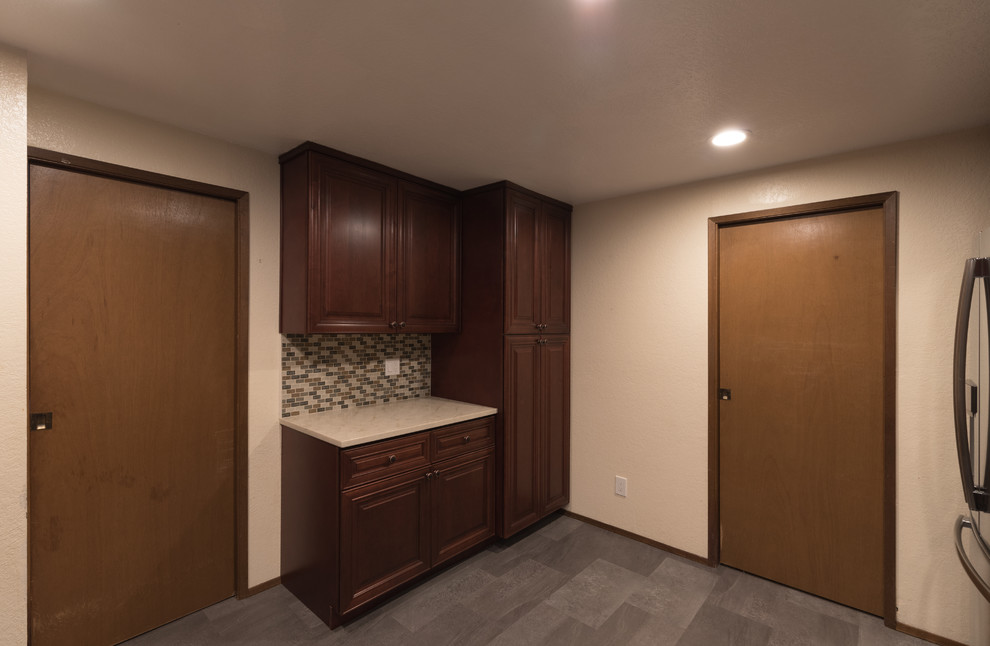Enclosed kitchen - mid-sized transitional u-shaped ceramic tile and gray floor enclosed kitchen idea in Seattle with an undermount sink, beaded inset cabinets, dark wood cabinets, quartz countertops, multicolored backsplash, ceramic backsplash, stainless steel appliances and no island