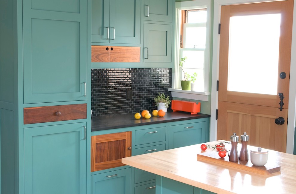 This is an example of a contemporary kitchen in Los Angeles with turquoise cabinets, shaker cabinets, black splashback and mosaic tile splashback.