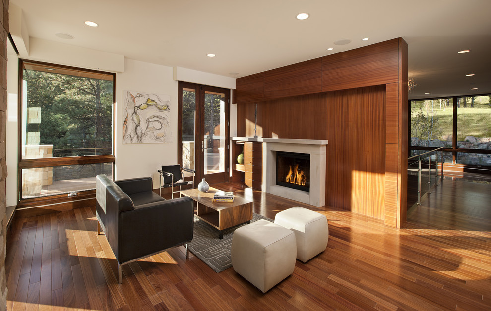 Inspiration for a modern open concept living room in Denver with a standard fireplace.