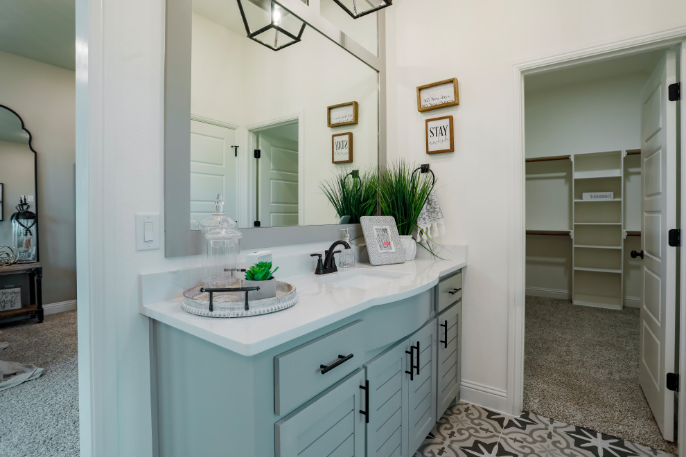 This is an example of a country master bathroom in Dallas with recessed-panel cabinets, grey cabinets, a freestanding tub, a curbless shower, white tile, ceramic tile, beige walls, ceramic floors, an undermount sink, granite benchtops, beige floor, white benchtops, an enclosed toilet, a single vanity and a freestanding vanity.