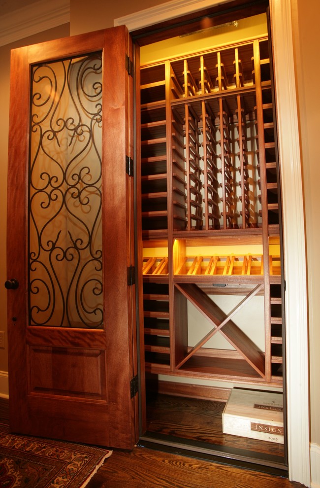 This is an example of a mediterranean wine cellar in Charlotte.