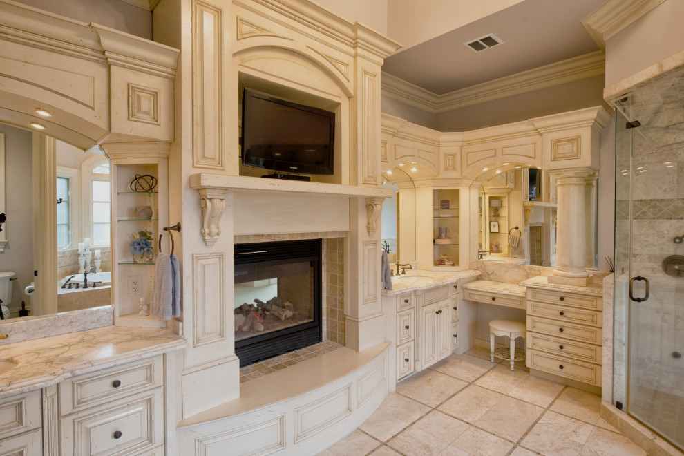 Inspiration for a large master bathroom in Raleigh with raised-panel cabinets, white cabinets, an alcove tub, an alcove shower, a one-piece toilet, beige tile, ceramic tile, grey walls, travertine floors, an undermount sink, granite benchtops, beige floor, a hinged shower door, white benchtops, a shower seat, a double vanity, a built-in vanity and vaulted.