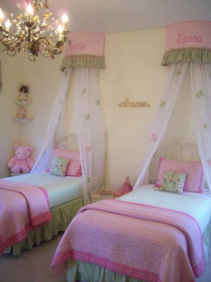 This is an example of a traditional kids' bedroom for kids 4-10 years old and girls in San Francisco with yellow walls and carpet.