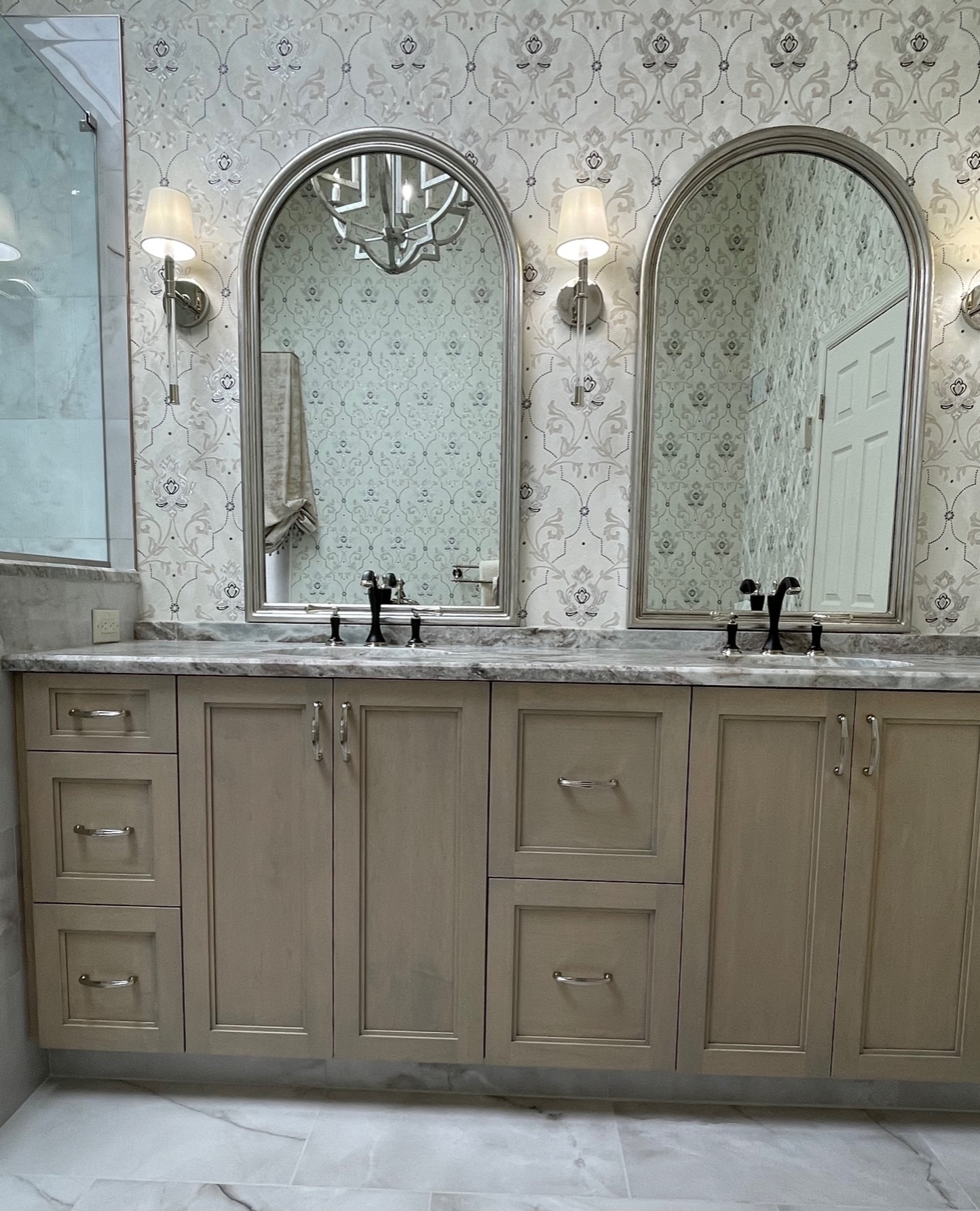 Porcelain floor & wall tile, freestanding sink, custom glass shower, custom window treatment, wallpaper, granite counter top, custom vanity