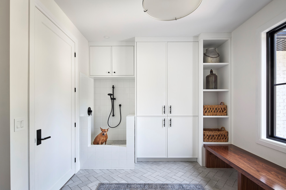 Design ideas for a transitional mudroom in Ottawa with white walls, ceramic floors, a single front door, a white front door and grey floor.