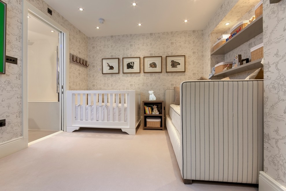 Design ideas for a transitional gender-neutral nursery in London with white walls, carpet and beige floor.