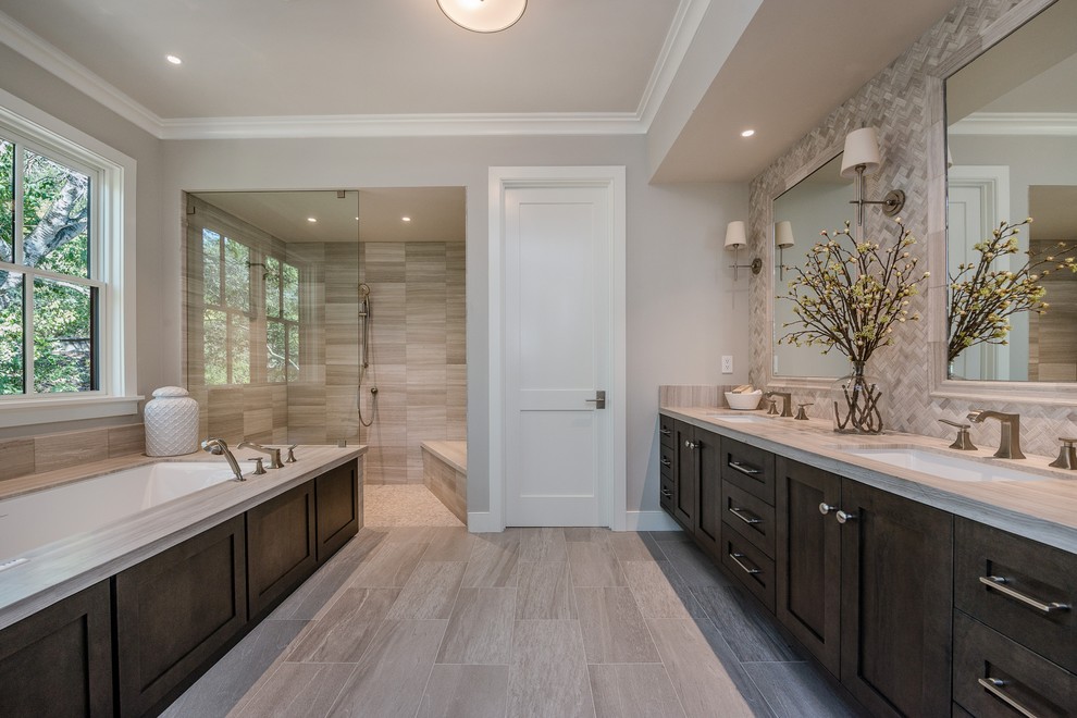Photo of a large country master bathroom in San Francisco with shaker cabinets, dark wood cabinets, an undermount tub, a curbless shower, gray tile, grey walls, an undermount sink, grey floor, an open shower, a one-piece toilet, ceramic tile, engineered quartz benchtops and porcelain floors.
