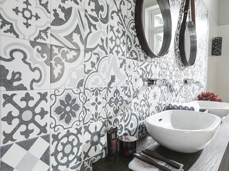 Inspiration for a transitional gray tile and white tile bathroom remodel with gray walls, a vessel sink and wood countertops