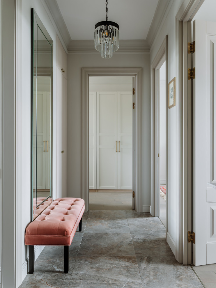 Inspiration for a mid-sized timeless gray floor entryway remodel in Moscow with gray walls