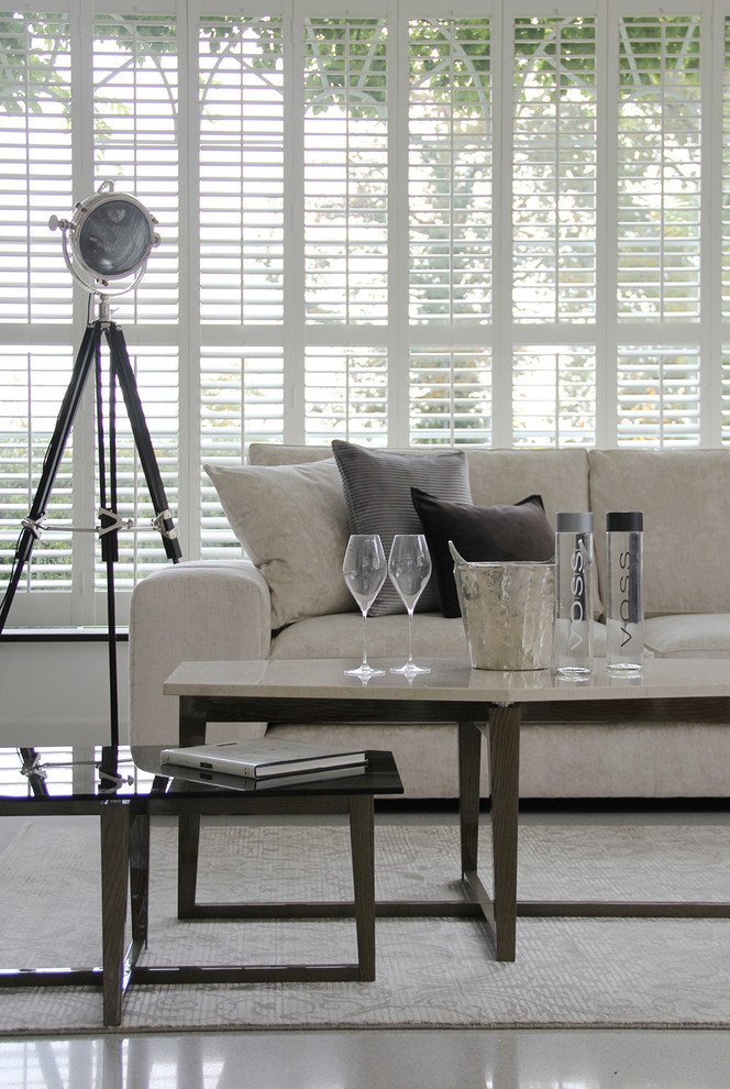Inspiration for a contemporary living room in Hertfordshire with marble floors.
